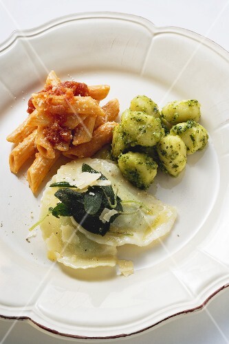 Three pasta dishes on one plate