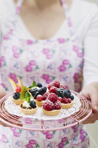 Berry tarts on a cake rack