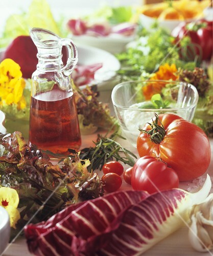 Summer vegetable still life with herbs and salad leaves