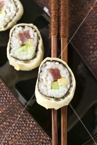 Maki sushi with tuna, cucumber and avocado
