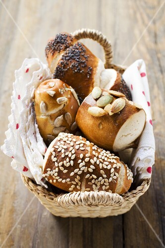 Assorted pretzel rolls (or lye rolls) in bread basket
