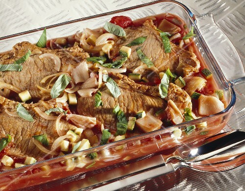 Pork chops with tomato sauce in a baking dish