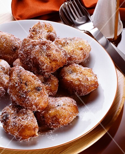 Small raisin doughnuts sprinkled with sugar