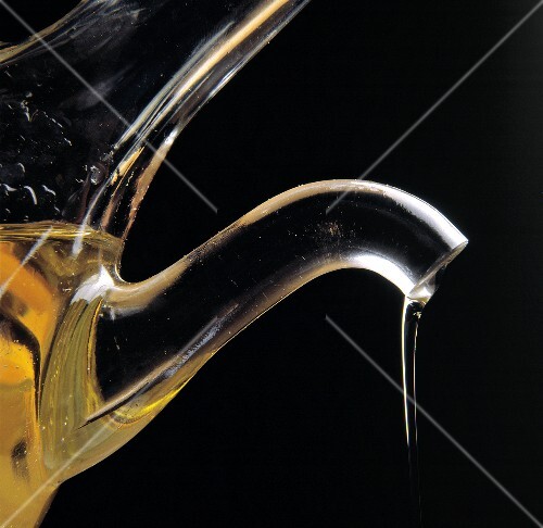 Olive Oil Pouring From a Cruet