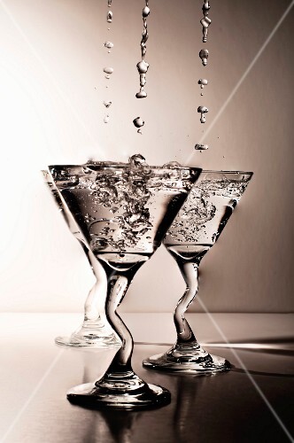 Martinis Dripping and Splashing into Glasses