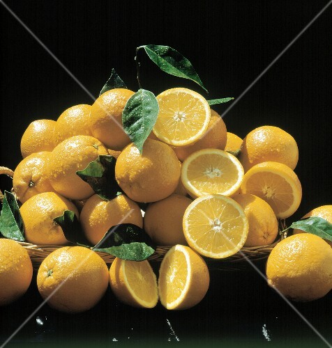 Freshly Washed Oranges and Orange Halves