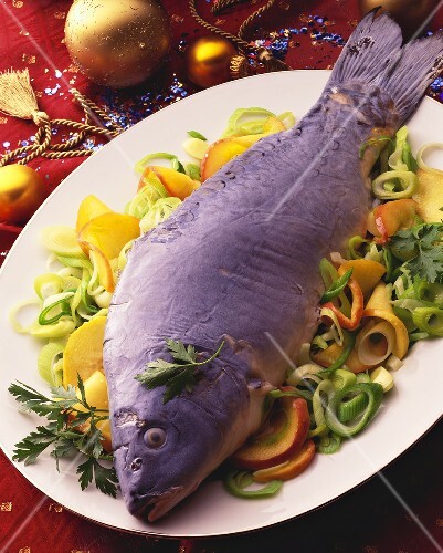 Carp cooked au bleu on leek with nectarine slices