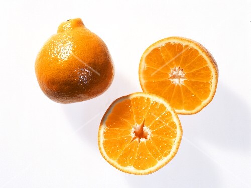 Whole and halved minneola