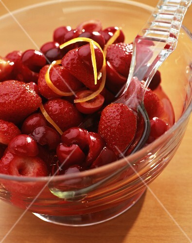 Strawberry and cherry salad in glass dish
