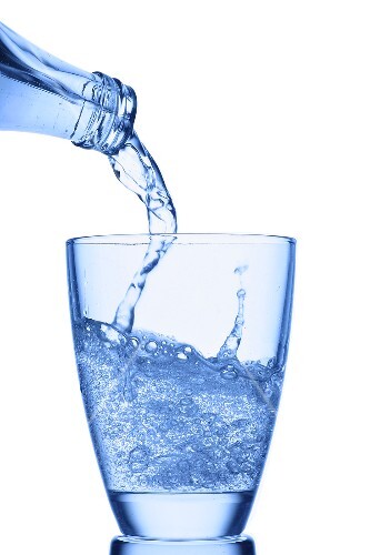 Pouring water into a glass
