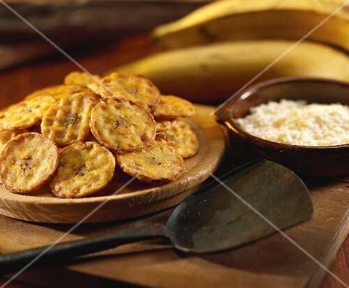Tostones (banana crisps with white cheese, Venezuela)