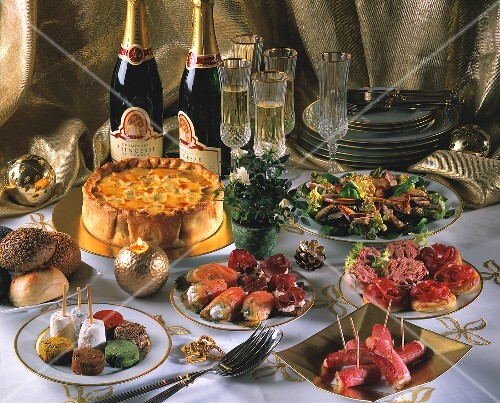 New Year's Eve buffet with snacks, salad, cake and champagne