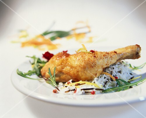 Chicken leg with rice and pink pepper
