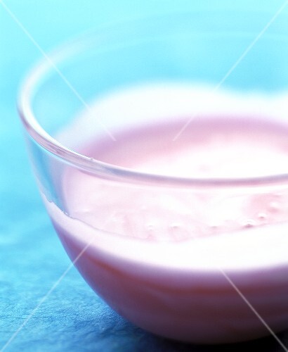 Pink icing in glass bowl
