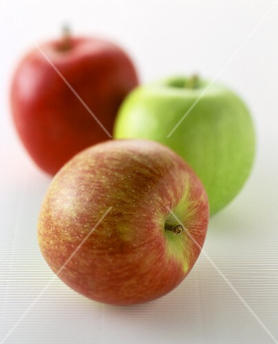 Red apples and a green apple