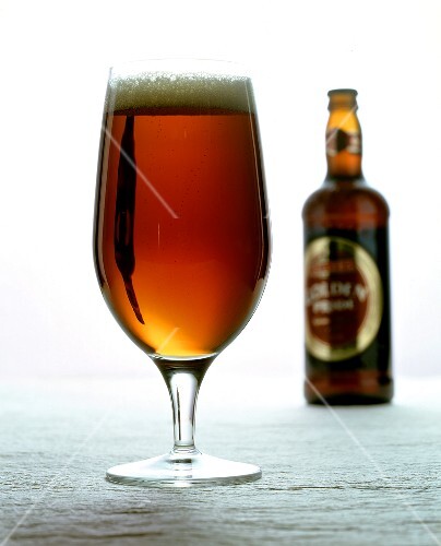 Dark ale (English beer) in glass and bottle
