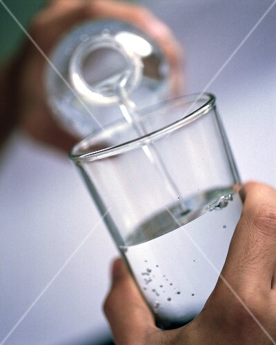 Pouring water into glass