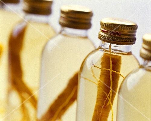 Bottled ginseng roots in bottles