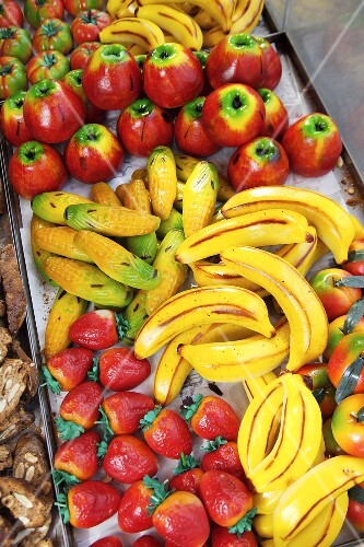 Assorted marzipan fruits on a market stall