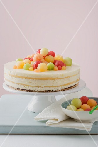 Yoghurt cheesecake with different coloured melon balls