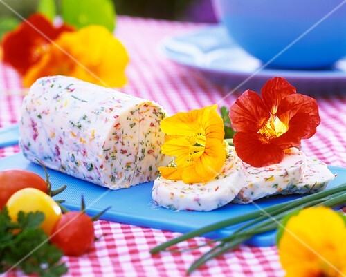 Herb butter decorated with nasturtium flowers