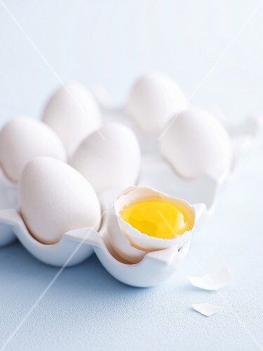 White eggs, one cracked open