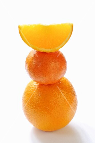 Orange, clementine and orange wedge, stacked