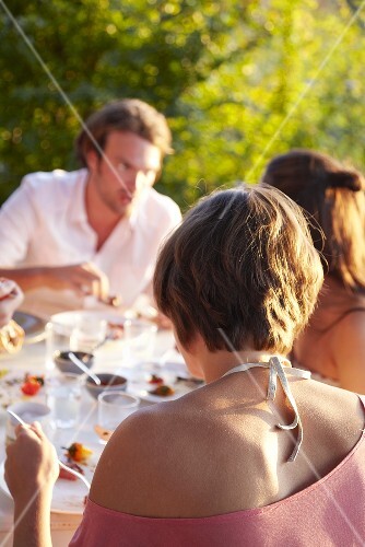 Young people eating out of doors