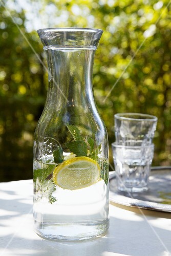 Carafe of water with lemon and mint
