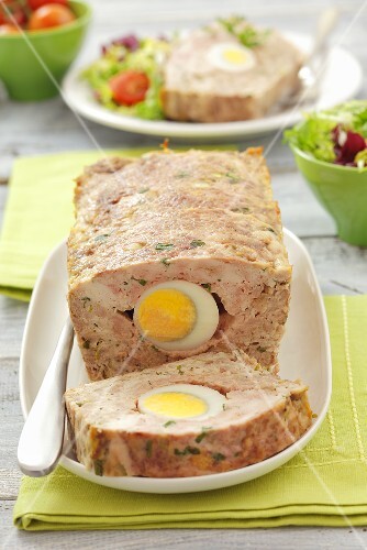 Meatloaf with egg, a slice cut