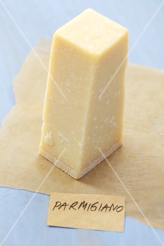 Piece of Parmesan cheese on paper