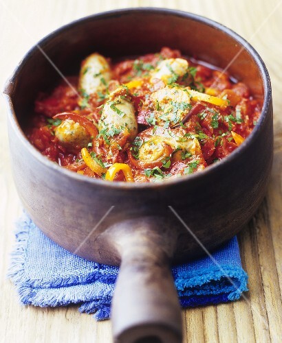 Basil dumplings in tomato and pepper sauce