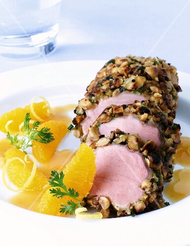 Pork fillet in peanut crust on spicy orange sauce