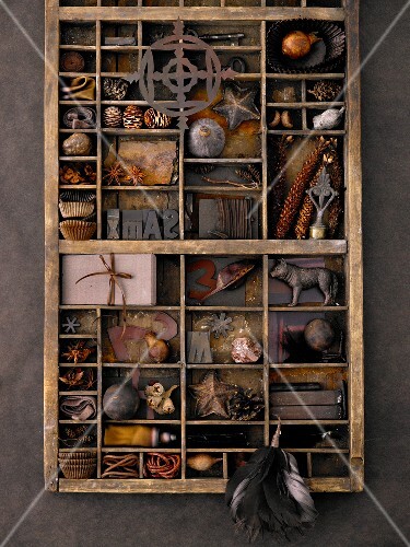 Type case filled with assorted trinkets