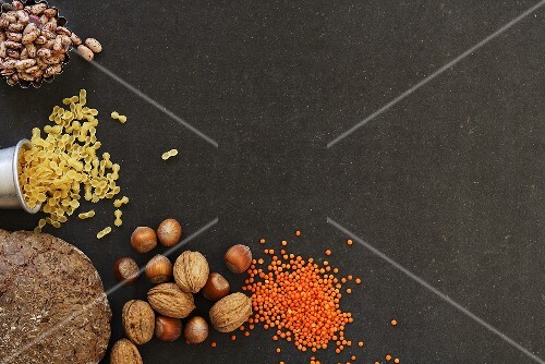 Still life with pasta, pulses, nuts and bread