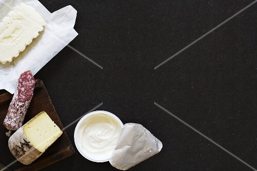 Still life with dairy products, sausage and cheese