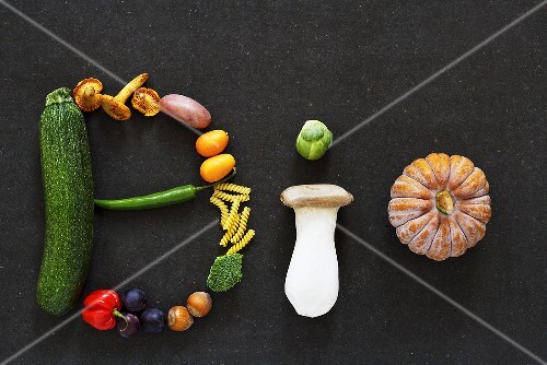 The word 'BIO' written in vegetables, mushrooms, fruit and nuts