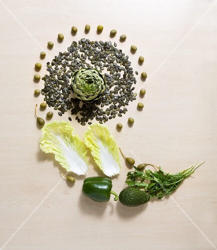 Still life with vegetables, capers and pumpkin seeds