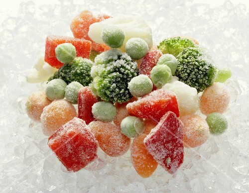 Frozen mixed vegetables on ice