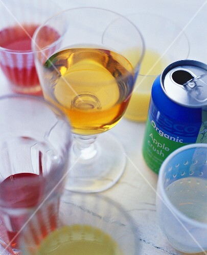 Various drinks in glasses and tin