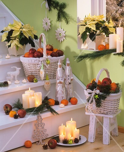 Staircase with Christmas decorations: candles, baskets of fruit etc.