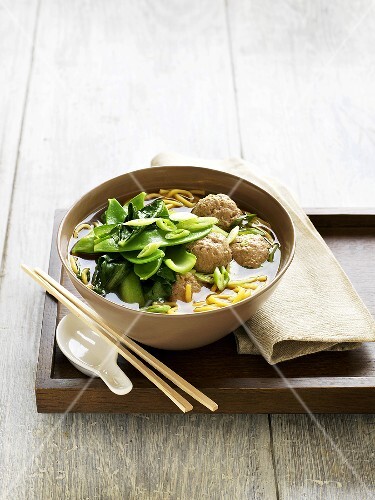 Soup with Chinese cabbage (choy sum) and meatballs