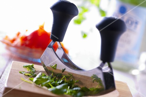Chopping herbs with mezzaluna