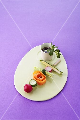 Raw vegetables on skewer with soy sauce