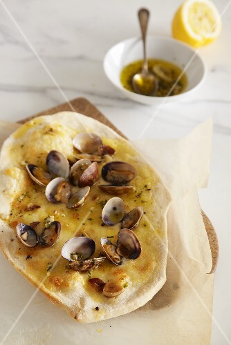 Pizza vongole with garlic and basil