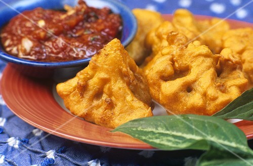Cauliflower fritters with spicy sauce