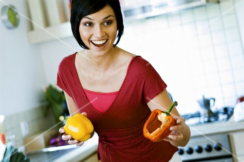Woman with fresh peppers