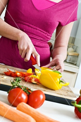Woman slicing vegetables (detail)