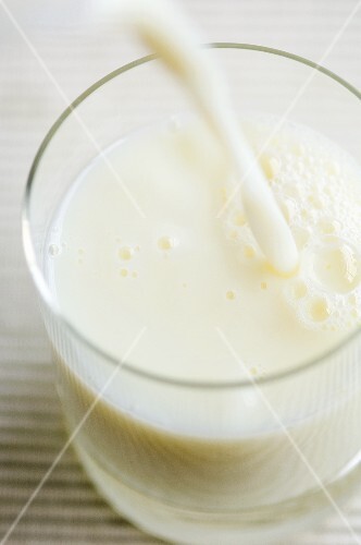Milk being poured into a glass