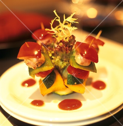 Vegetable kebabs with green salad